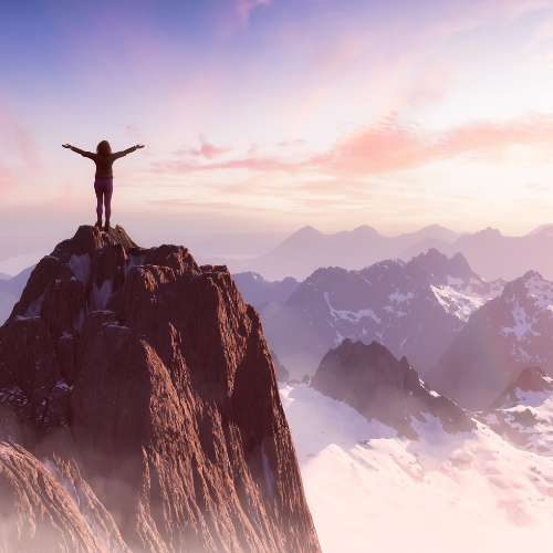 lone person on top of a mountain